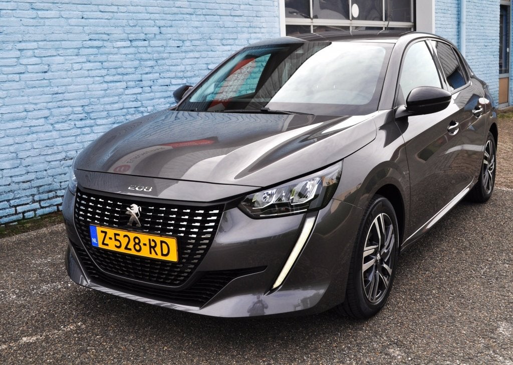 Peugeot 208 1.2 Allure Aut. pdc. crc. egtg (bj 2023), 101 pk, Gebruikt, Euro 6, Leder en Stof