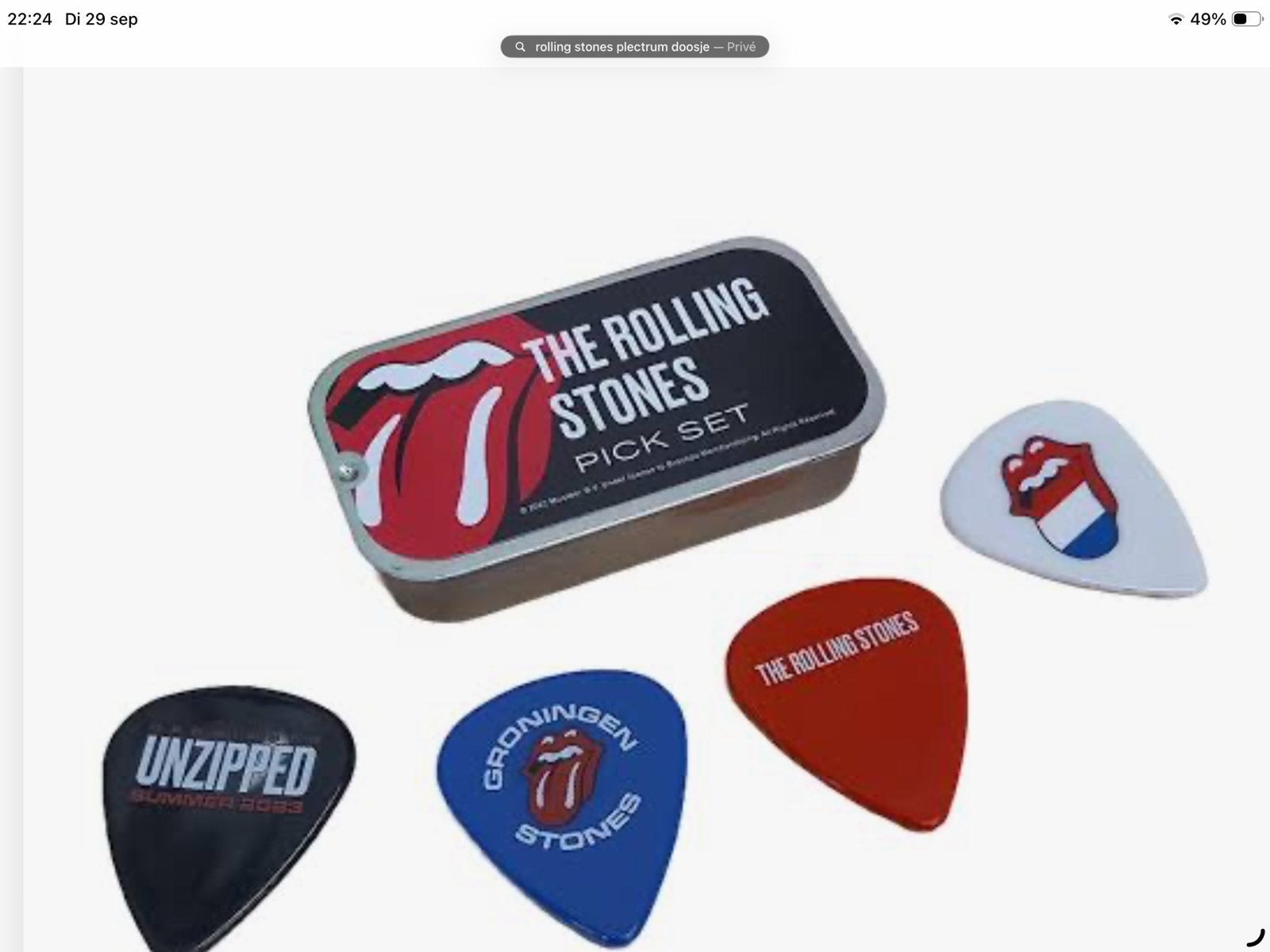 GEVRAAGD. The Rolling Stones plectrum doosje.