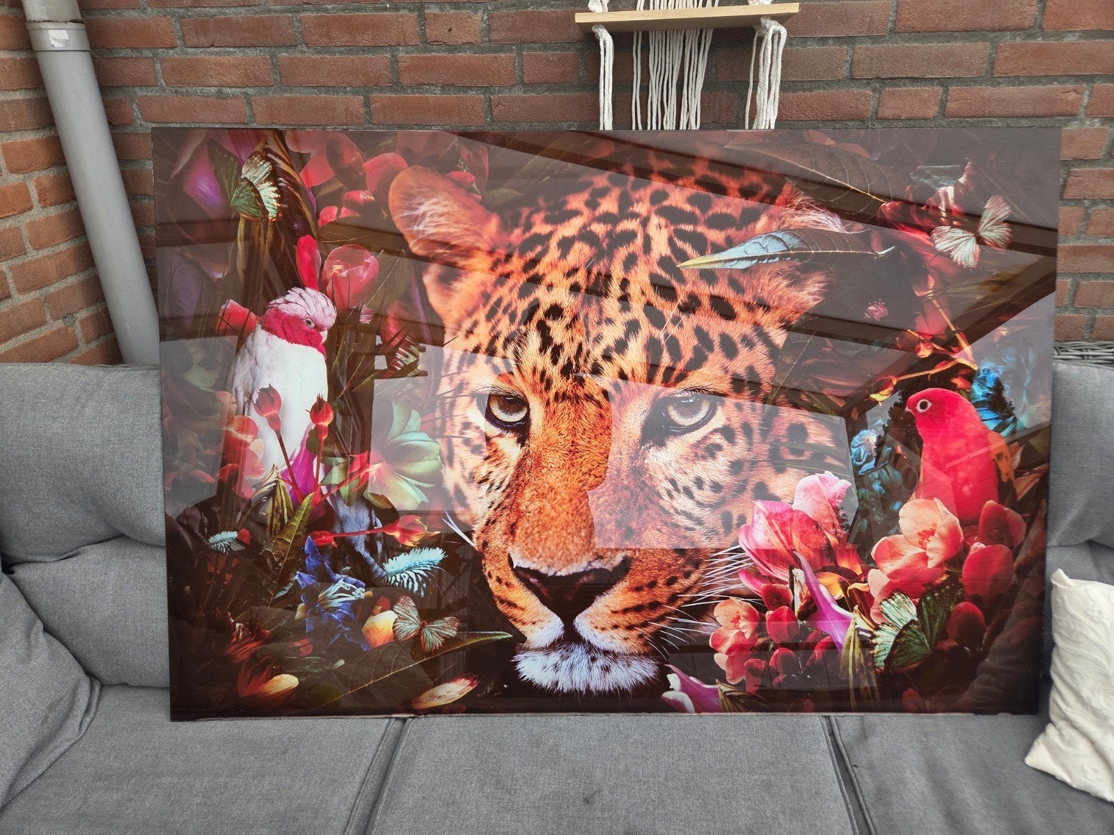Glasschilderij panter in jungle met bloemen en vogels 160x11, Ophalen