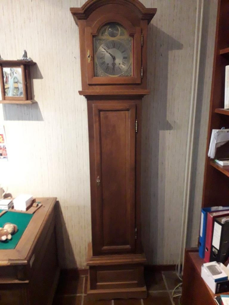 Klassieke staande klok van hout, Ophalen