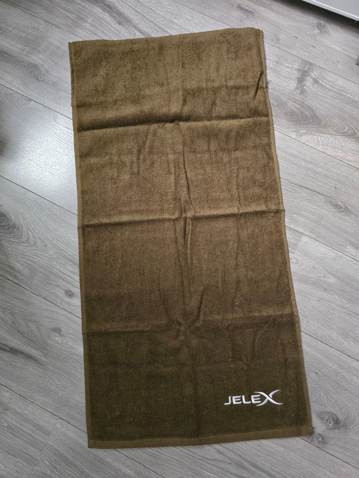 Khaki Jelex Fitness handdoek met zak, 90x45cm, Nieuw (PC2), Ophalen of Verzenden, Nieuw, Theedoek of Handdoek