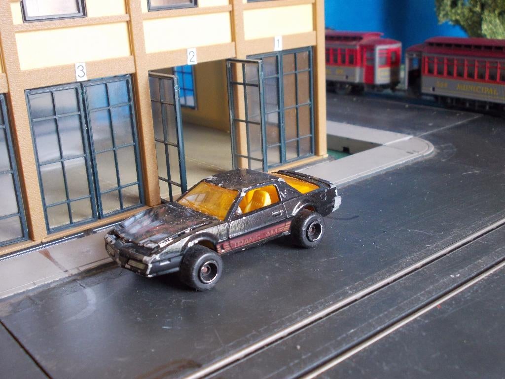 1:62 Pontiac Firebird Trans-Am Majorette brede wielen zwart, Ophalen of Verzenden, Gebruikt, Auto