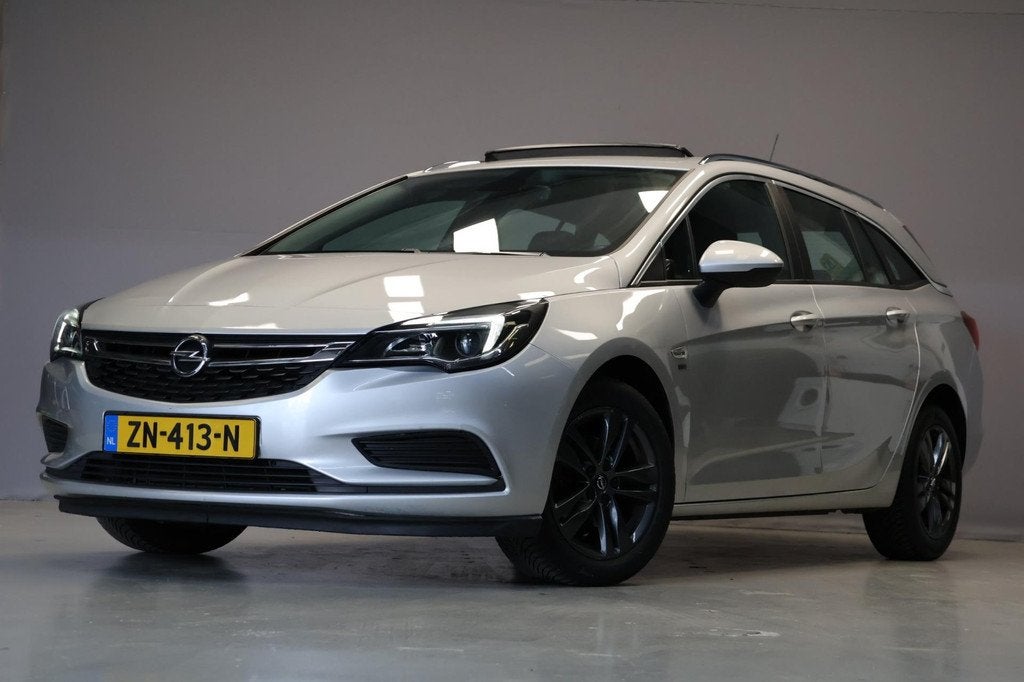 Opel Astra Sports Tourer 1.4 Turbo 120 Jahre|Automaat|Pano|C, Auto's, Opel, Stof, Gebruikt, 150 pk, Origineel Nederlands