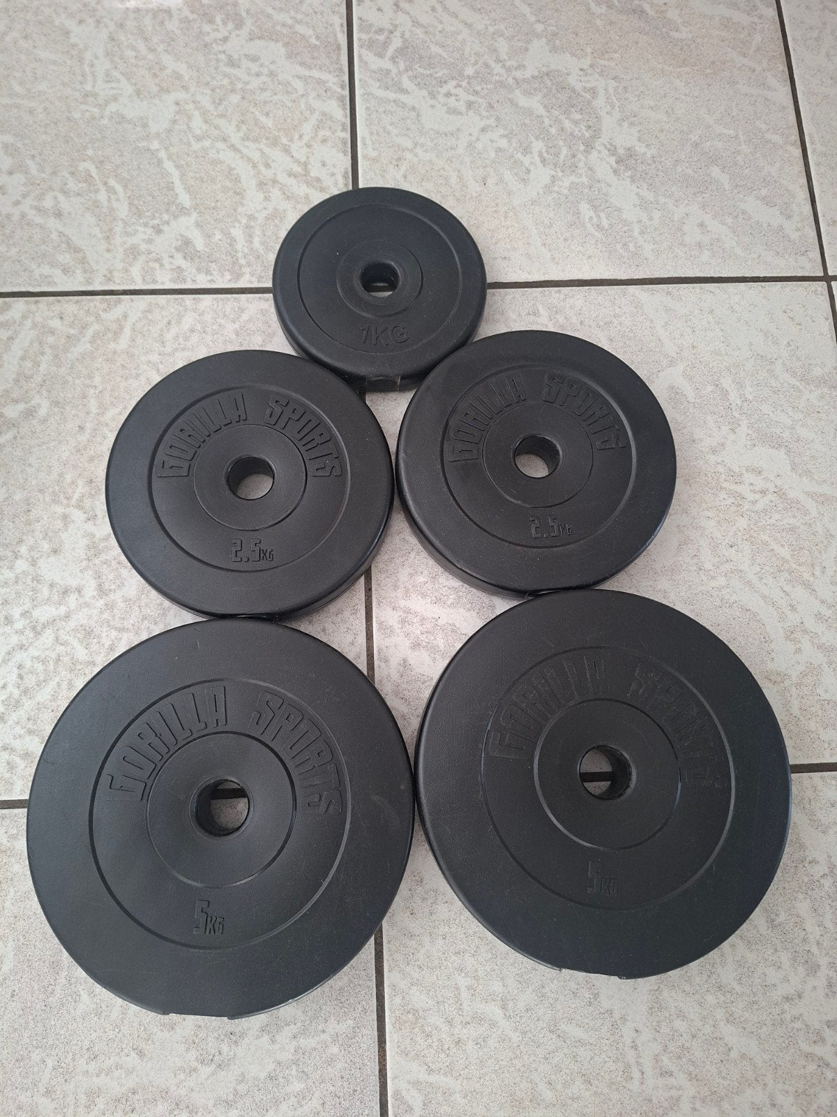Halterschijven  Gorilla sports  2x 5kg, 2x 2.5kg, 1x 1kg, Ophalen