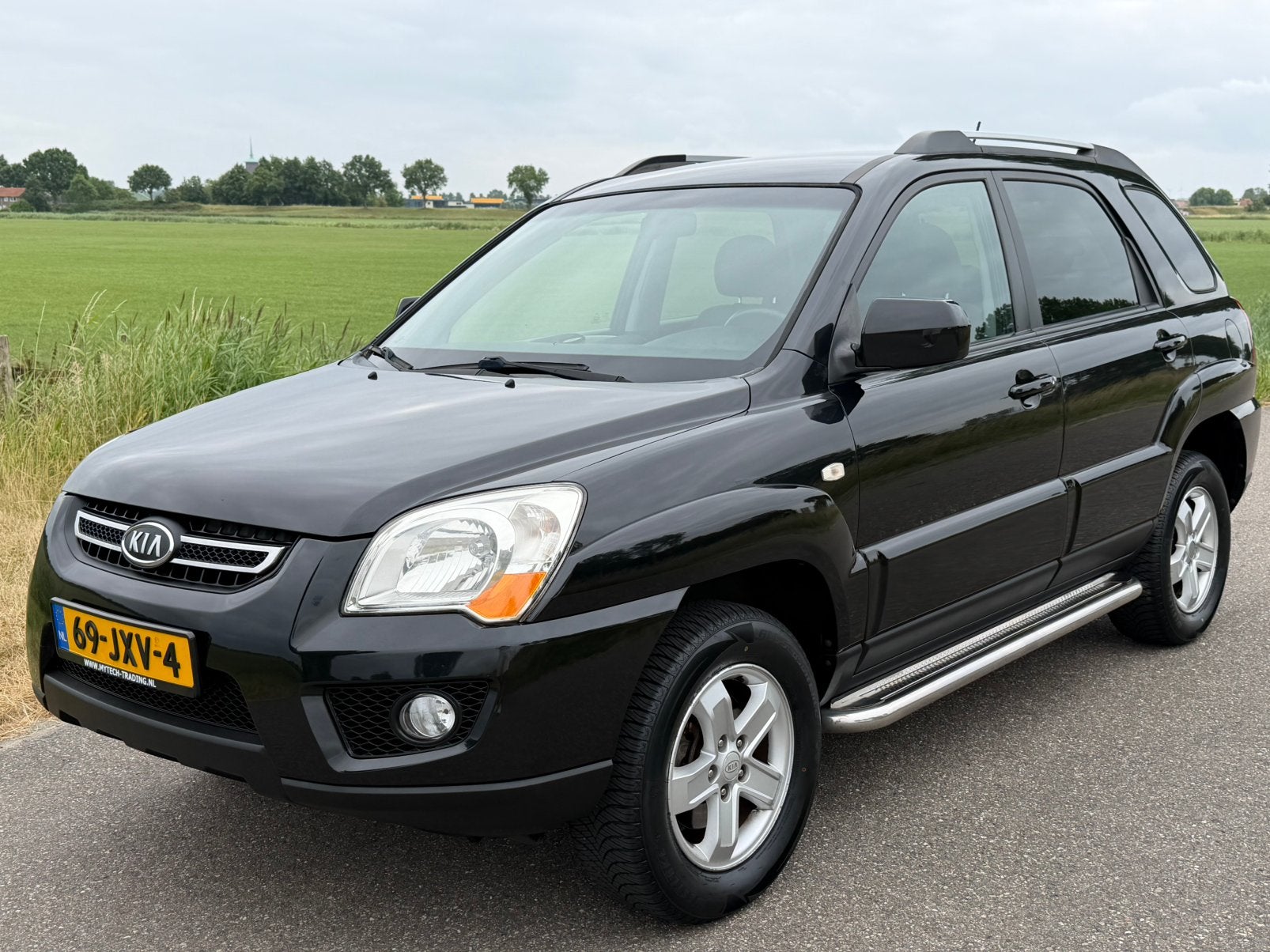 Kia Sportage 2.0 2WD Nieuwe Distributie, Apk en Banden, 1442 kg, 4 cilinders, Zwart, Origineel Nederlands