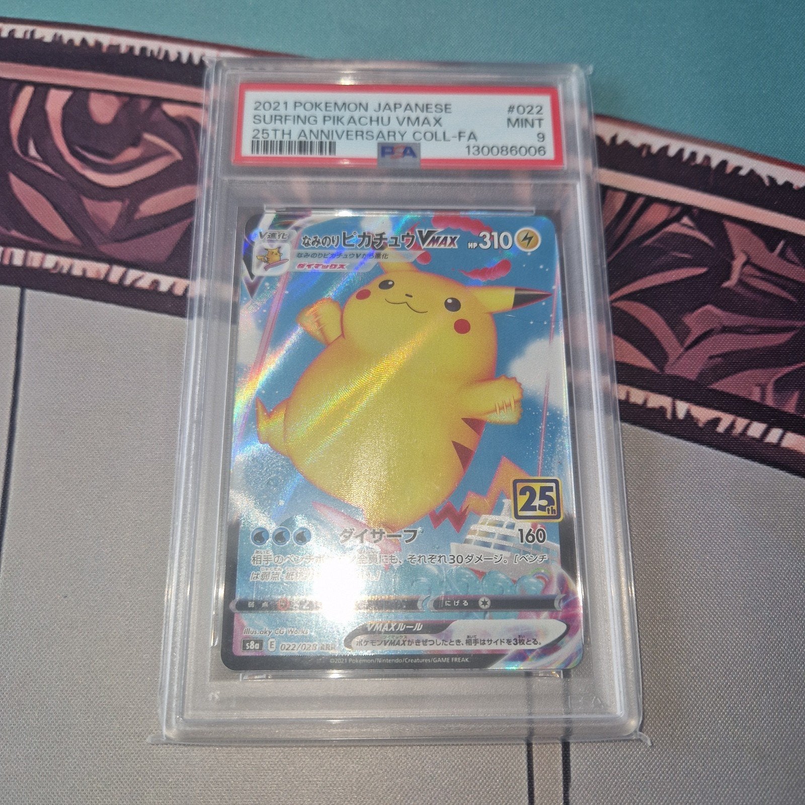 2021 Pokemon Surfing Pikachu VMAX 25th Anniversary PSA 9, Ophalen of Verzenden, Zo goed als nieuw, Losse kaart, Foil