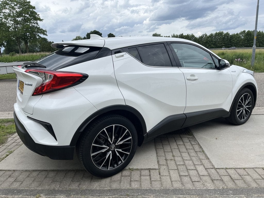 Toyota C-HR 1.8 Hybrid Dynamic / Automaat / Camera / Climate, Auto's, 12 maanden, Stof, 4 cilinders, Overige brandstoffen