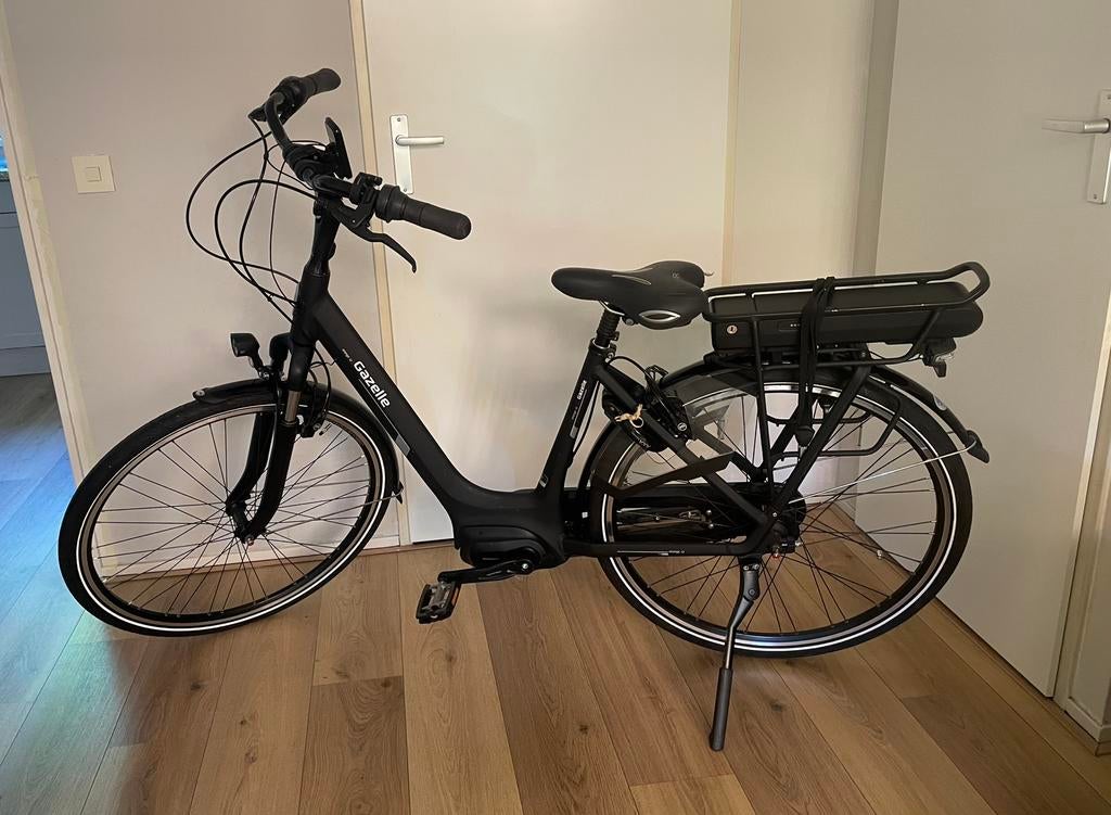 Gazelle orange C7. maat DLi49, Ophalen, Zo goed als nieuw, 47 tot 51 cm, 50 km per accu of meer