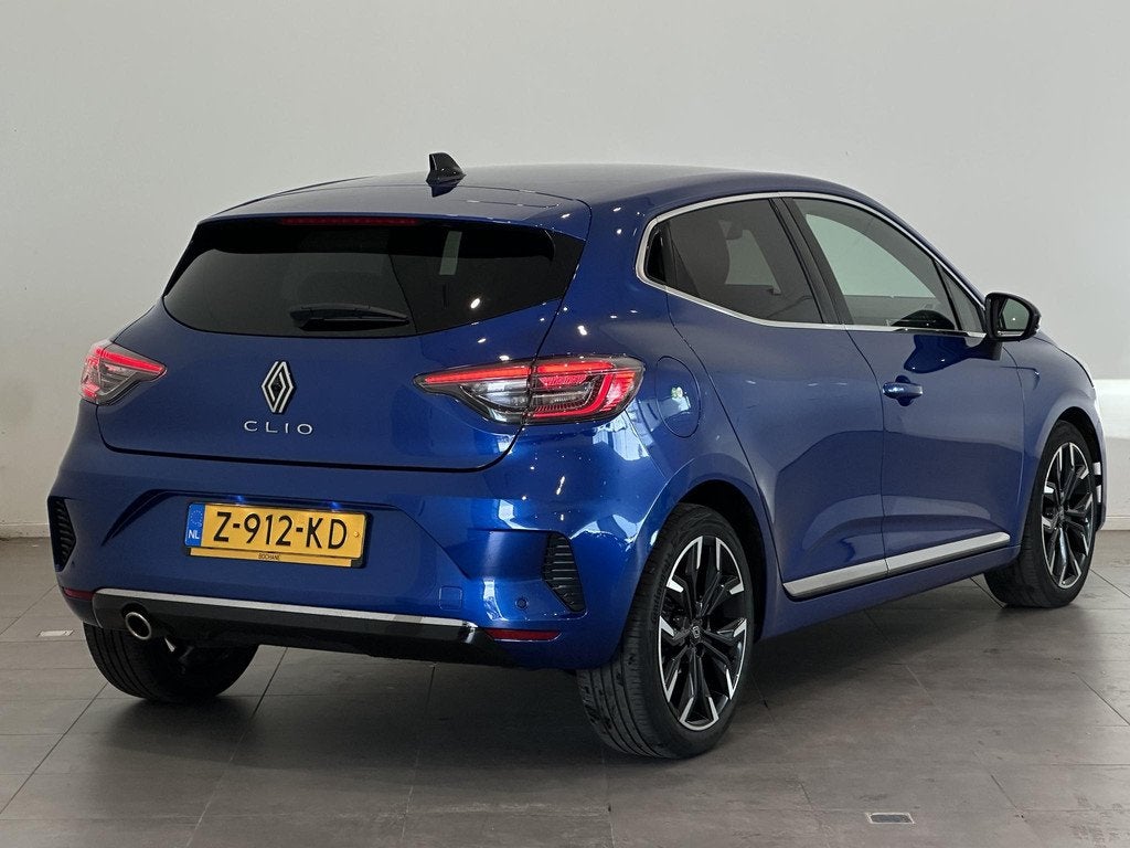 Renault Clio 1.0 TCe 90 Techno | Navigatie 9,3" | Climate Co, Auto's, Renault, Met garantie (alle), Blauw, Leder en Stof, 49 €/maand