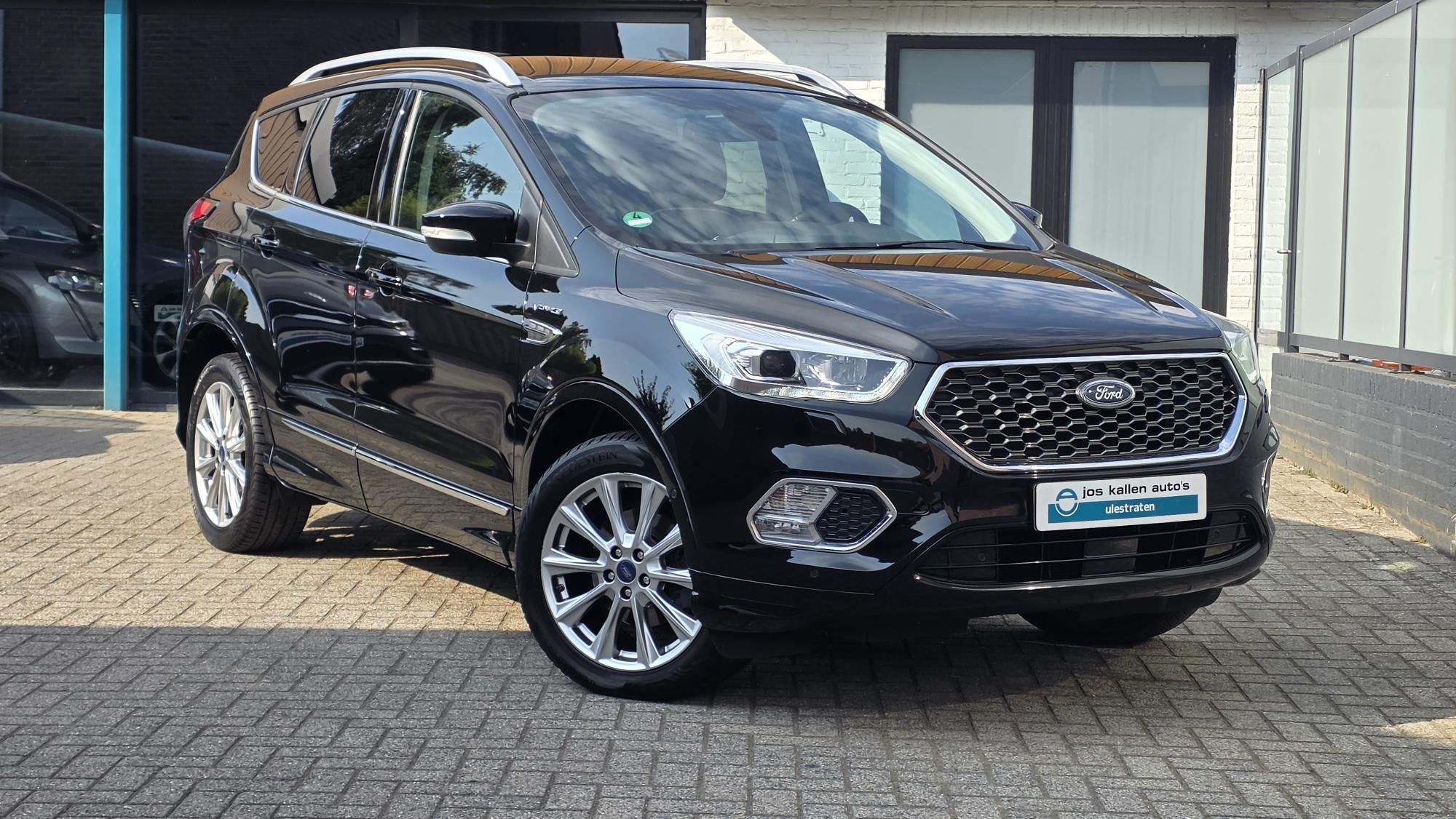 Ford Kuga 1.5 EcoBoost Vignale 150pk Navi, EL Trekhaak, Wint, Auto's, Dealer onderhouden, Euro 6, 4 cilinders, Zwart
