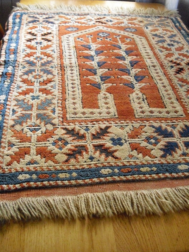 Perzisch tapijt/tafelkleed, Ophalen