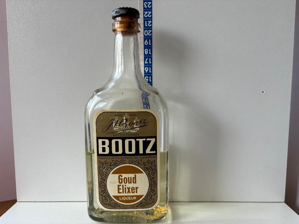 Oude Bootz drankfles met deels inhoud goud elixer liqueur, Ophalen of Verzenden, Gebruikt, Overige typen