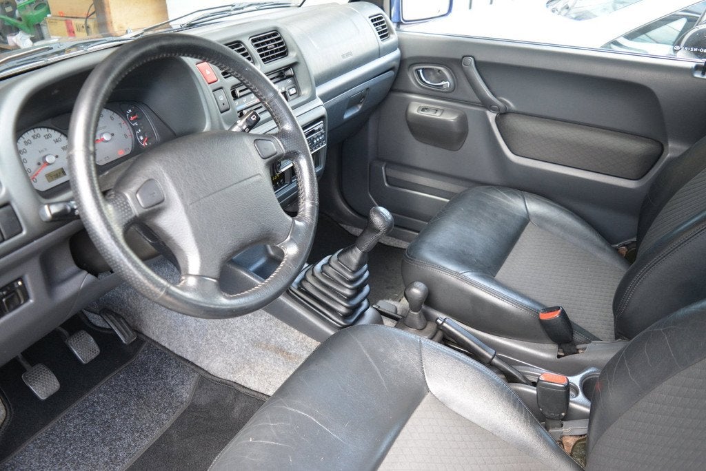 Suzuki Jimny 1.3 Two-Tone | Airco | Leder | Trekhaak | 77.00, Auto's, 13 km/l, Zwart, 4 cilinders, Bedrijf