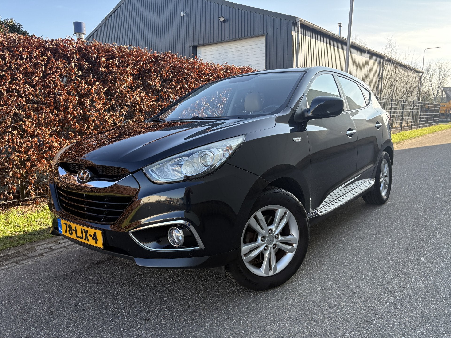 Hyundai ix35 2.0i Dynamic / NAVI / LEER / AIRCO / CRUISE, Auto's, 4 cilinders, Zwart, Handgeschakeld, 165 pk