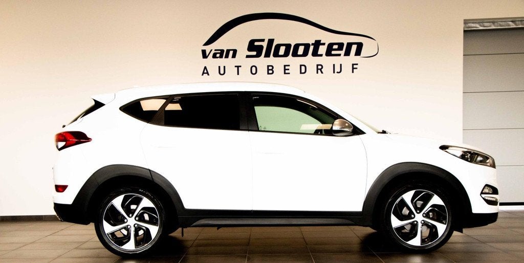 Hyundai Tucson 1.6 T-GDi Comfort 4WD| Navi| Camera| Cruise|, Auto's, Hyundai, Stof, Gebruikt, 4 cilinders, Wit