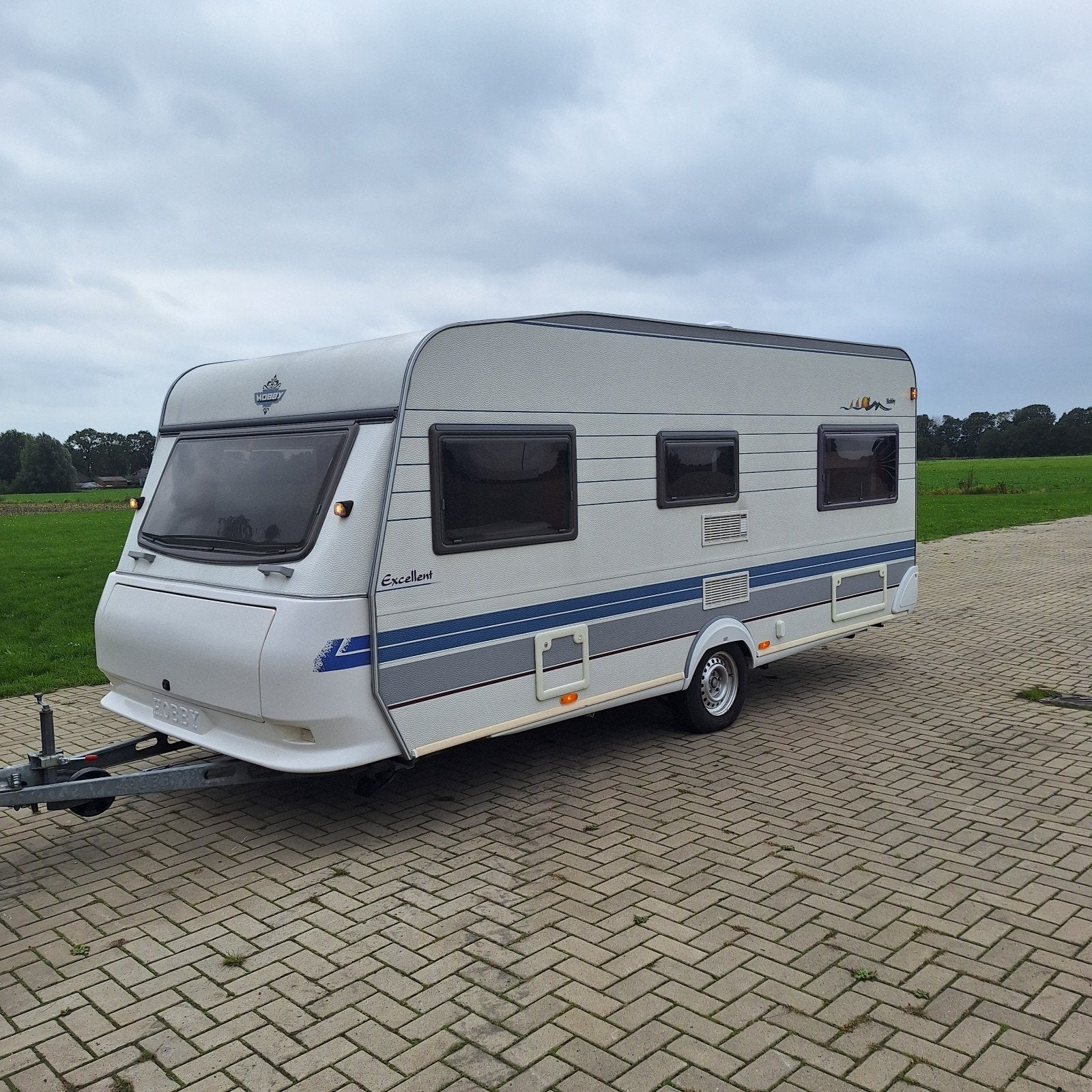 Hobby Excellent 495, Luifel, Stapelbed, Douche, Caravans en Kamperen, Rondzit, Hobby, Bedrijf, 4 tot 5 meter