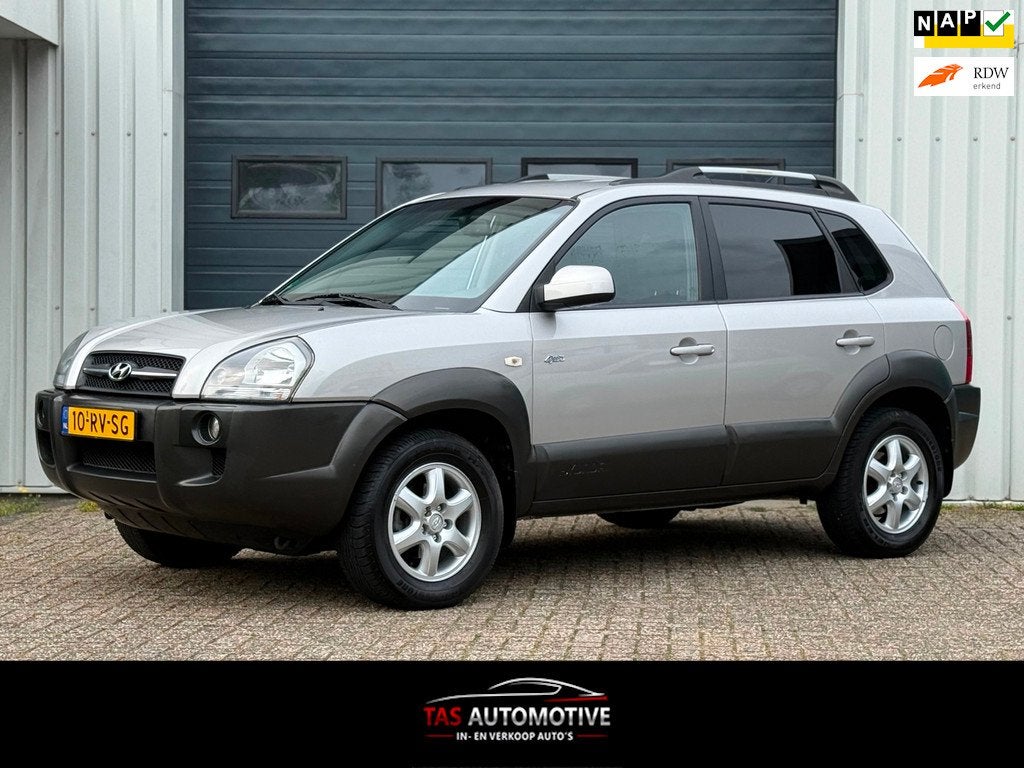 Hyundai Tucson 2.7i V6 4WD Style 2e EIG / AUTOMAAT / LEER, Auto's, Hyundai, Automaat, Stoelverwarming, Gebruikt, 2656 cc