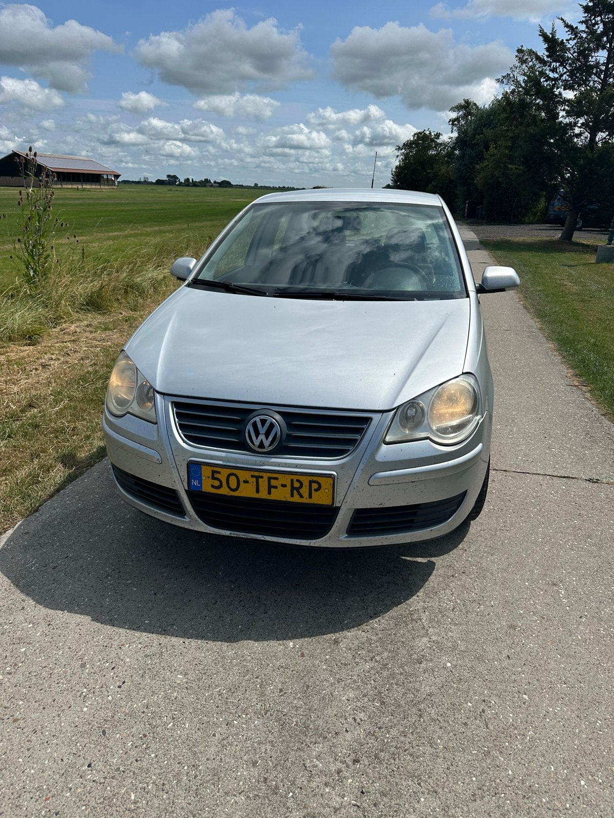 Volkswagen Polo 1.4 16V 59KW 2006 Grijs, Auto's, Volkswagen, Voorwielaandrijving, 15 km/l, 40 €/maand, 4 cilinders