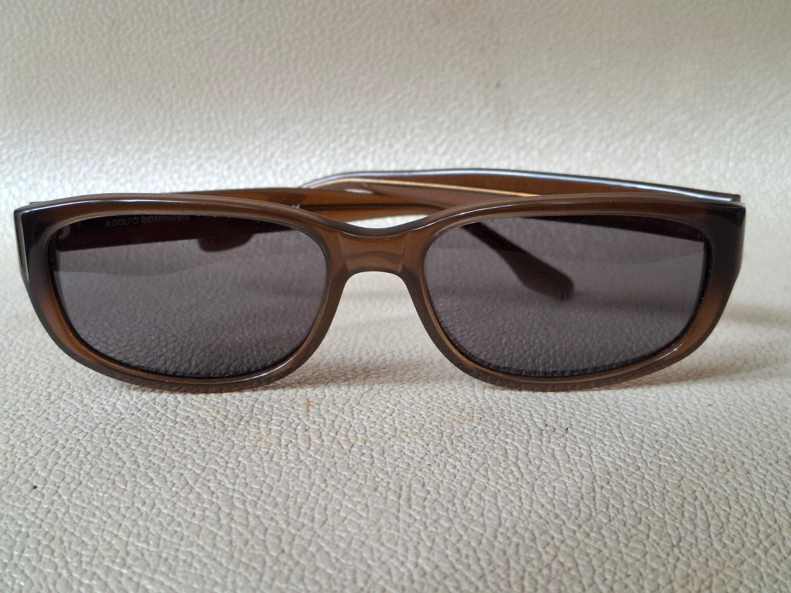 Adolfo Dominguez zonnebril sunglass als nieuw, Ophalen of Verzenden, Zo goed als nieuw, Bruin, Overige merken
