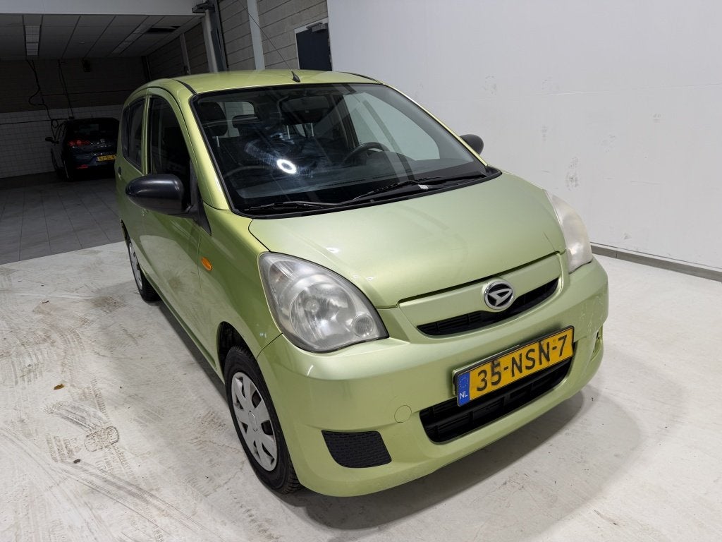 Daihatsu Cuore 1.0 Comfort (bj 2010), Auto's, Voorwielaandrijving, Stof, 18 €/maand, 4 stoelen