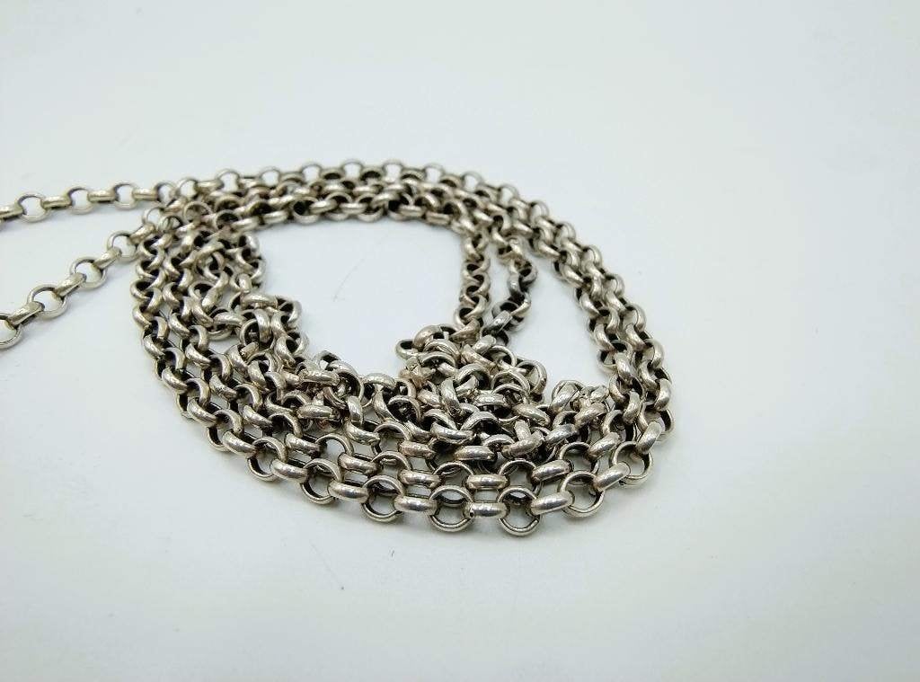 Zilveren jasseronketting met breipendoppen (laarzen), 79 cm., Verzenden, Zilver, Ring