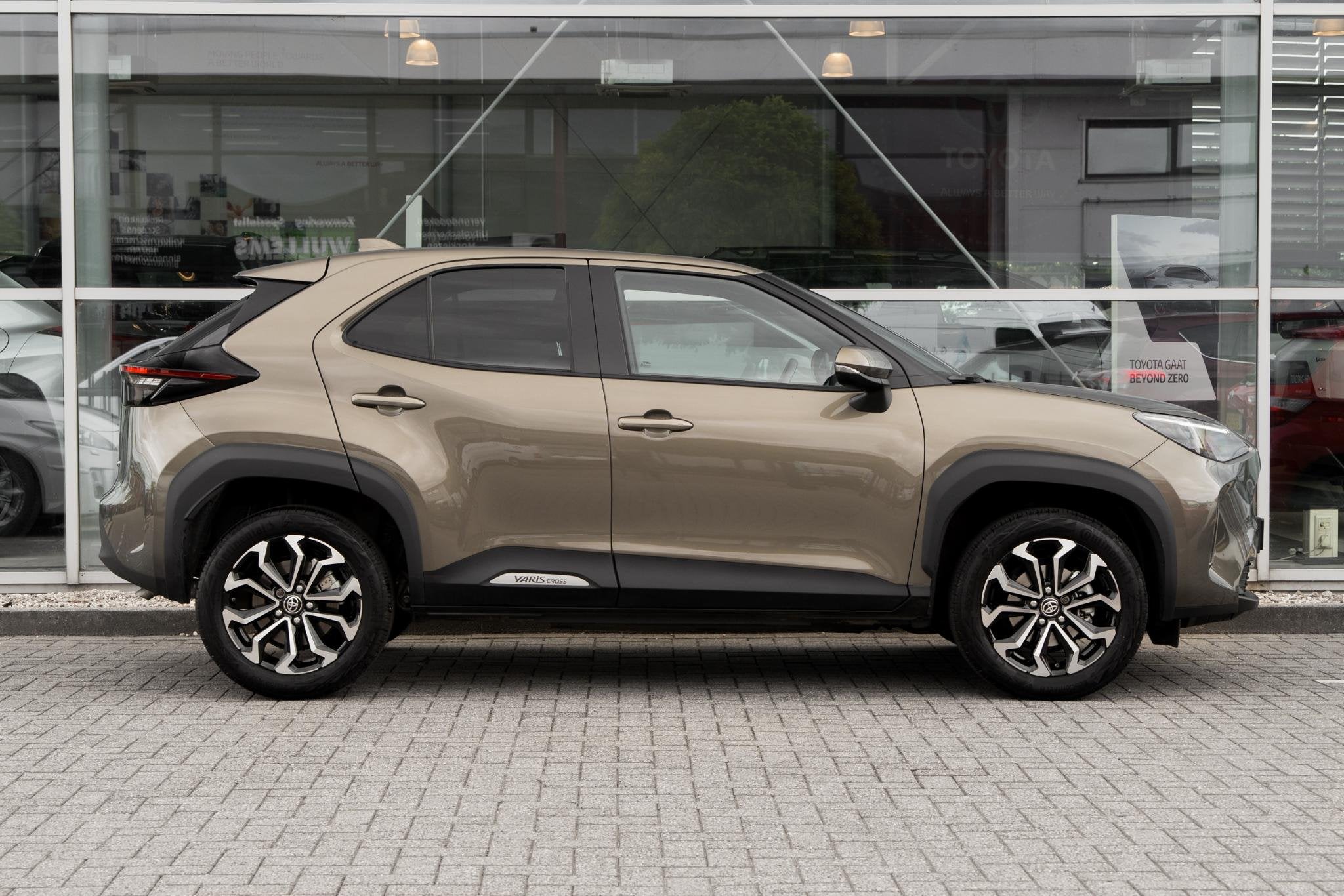Toyota Yaris Cross 1.5 Hybrid First Edition, Auto's, Stof, Gebruikt, Automatische klimaatregeling, 116 pk