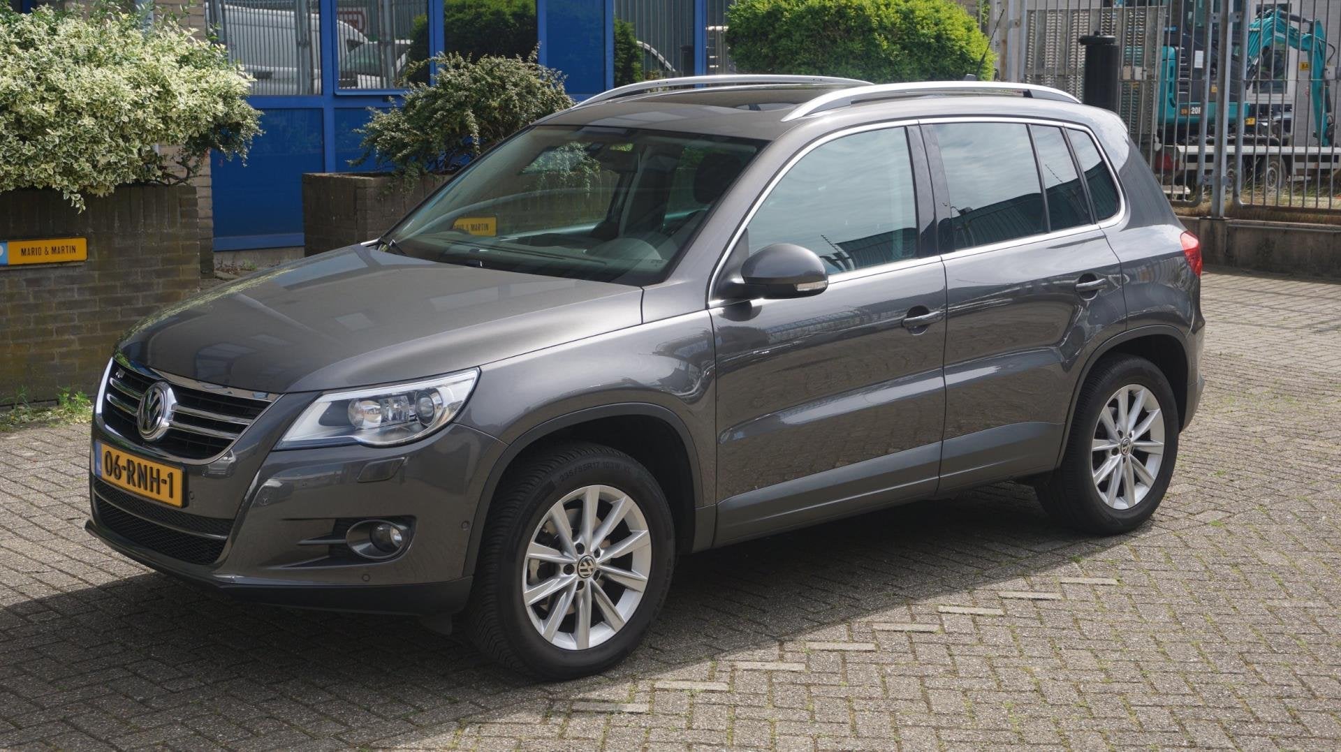 Volkswagen Tiguan 1.4 TSI 150PK Sport & Style, Auto's, Voorwielaandrijving, Euro 5, Zwart, 4 cilinders