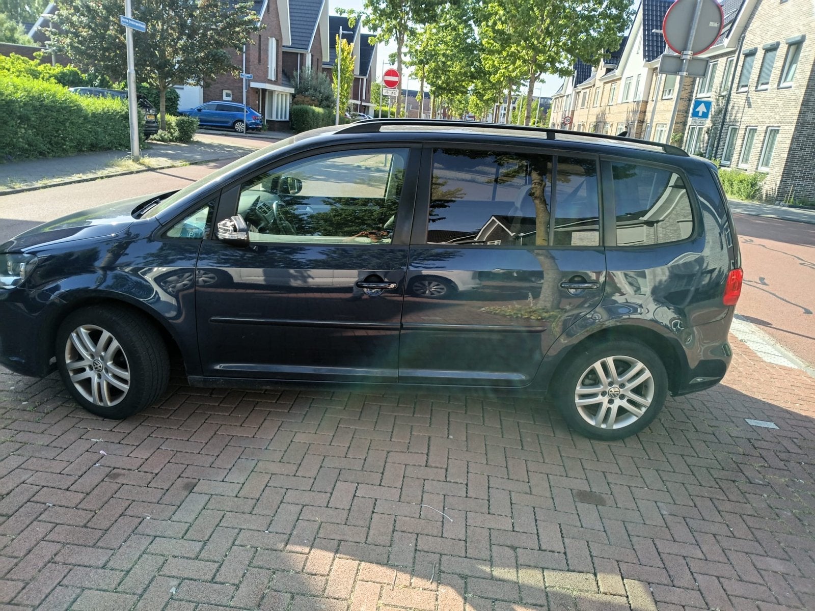Volkswagen Touran 1.2 TSI 77KW BMT 7P 2012 Blauw, Auto's, Voorwielaandrijving, 4 cilinders, Blauw, 7 stoelen