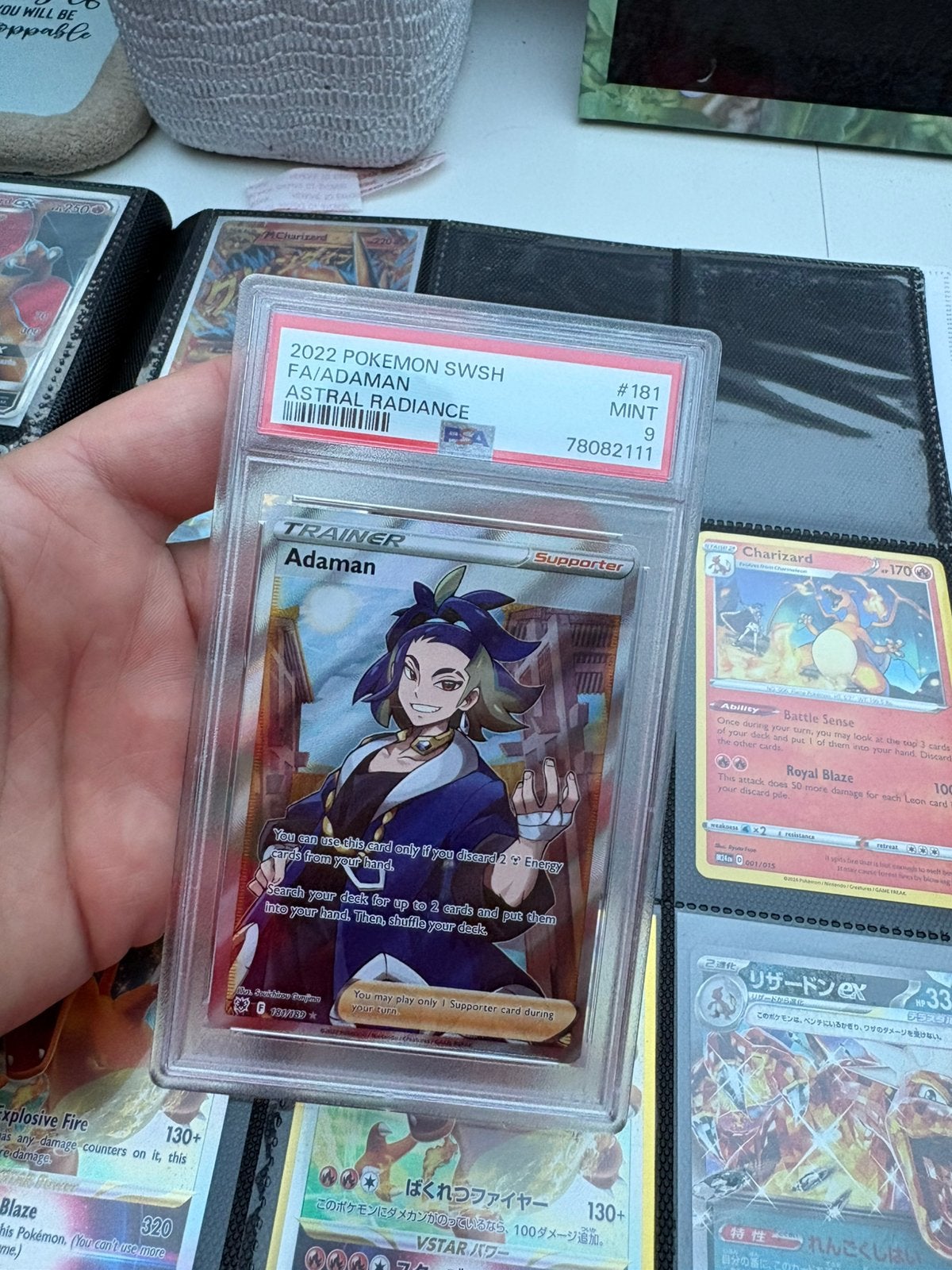 Adaman psa 9, Ophalen of Verzenden, Zo goed als nieuw, Meerdere kaarten, Foil