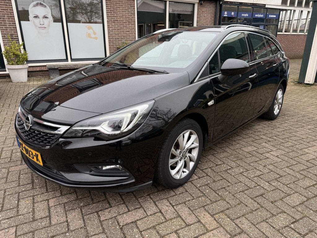Opel Astra Sports Tourer 1.4 Innovation (bj 2017, automaat), Auto's, Stof, Gebruikt, 150 pk, Zwart