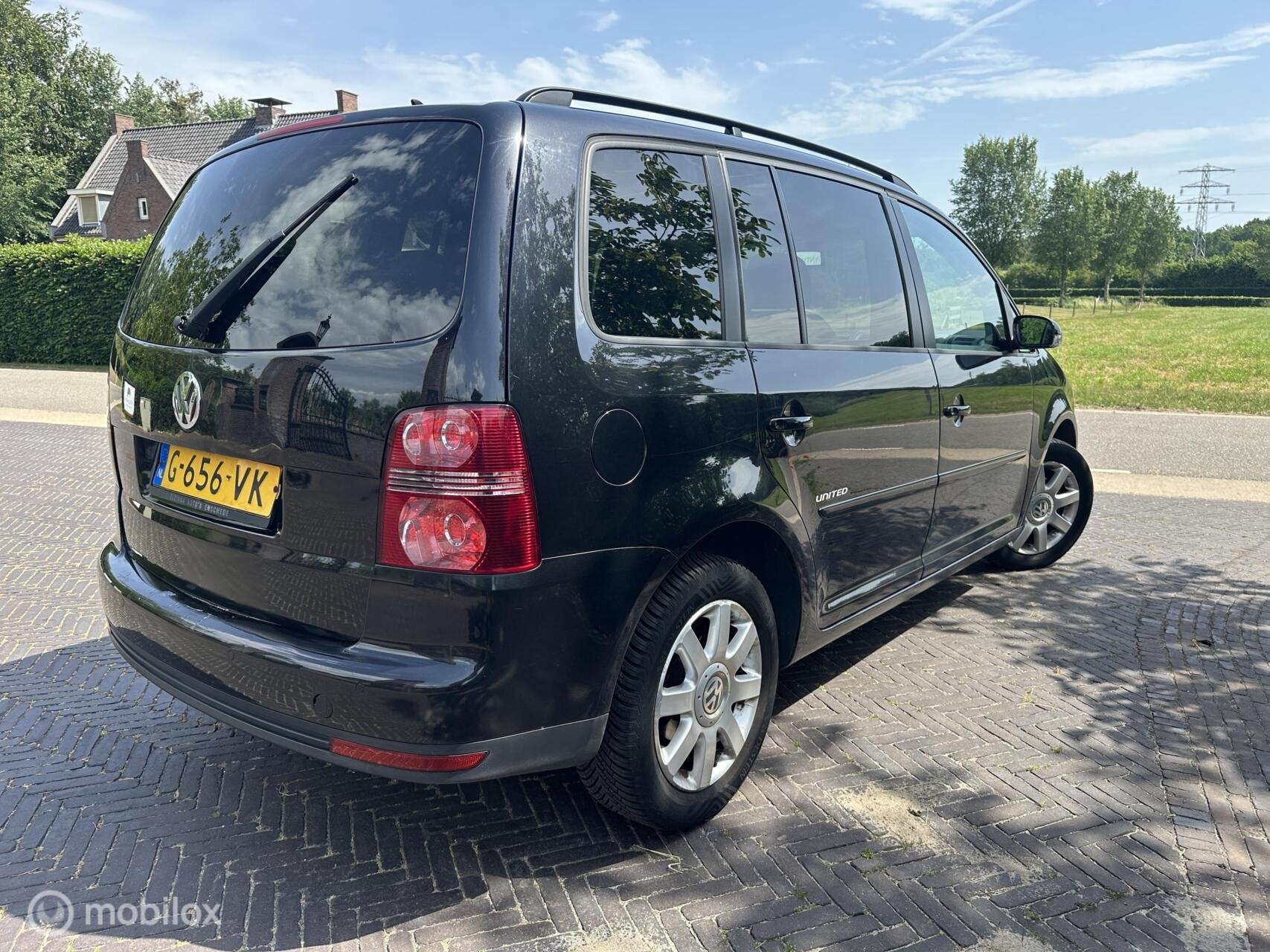 Volkswagen Touran 1.6 2009 7-personen Airco Navi Cruise✅, Auto's, Voorwielaandrijving, Euro 5, Stof, Gebruikt