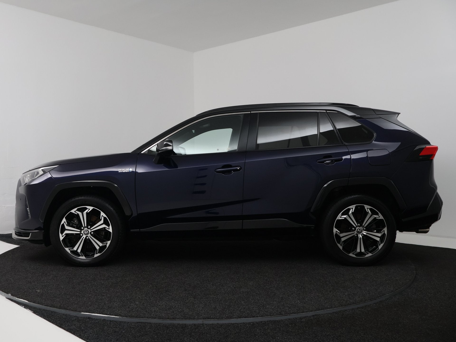 Toyota RAV4 2.5 Plug-in Hybrid AWD Bi-Tone Plus | Navigatie, Auto's, Automaat, 12 maanden, Gebruikt, 4 cilinders