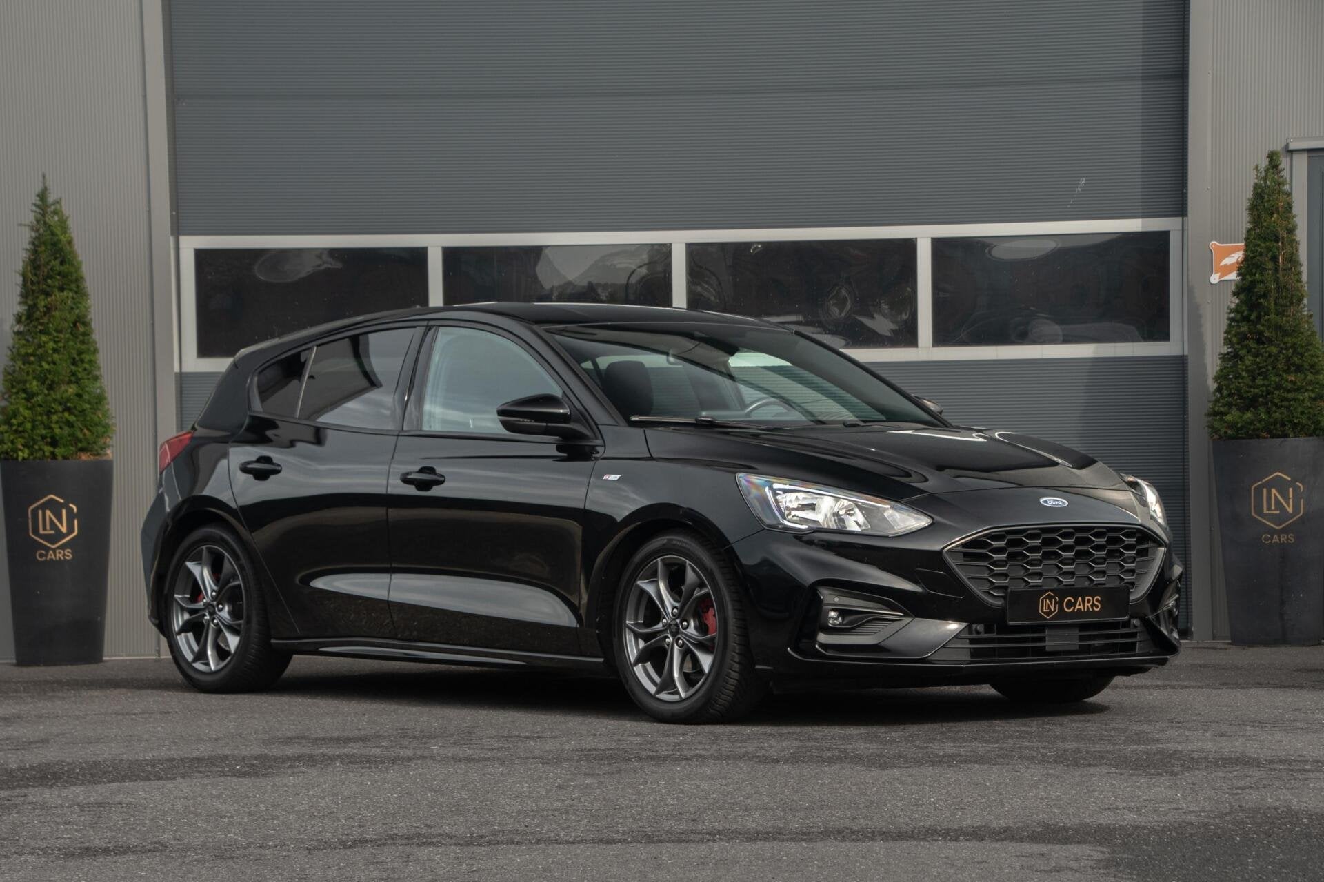 Ford Focus 1.0 EcoBoost Titanium ST-line| Cruise | Navi, Auto's, Ford, Gebruikt, Met garantie (alle), Zwart, Bedrijf