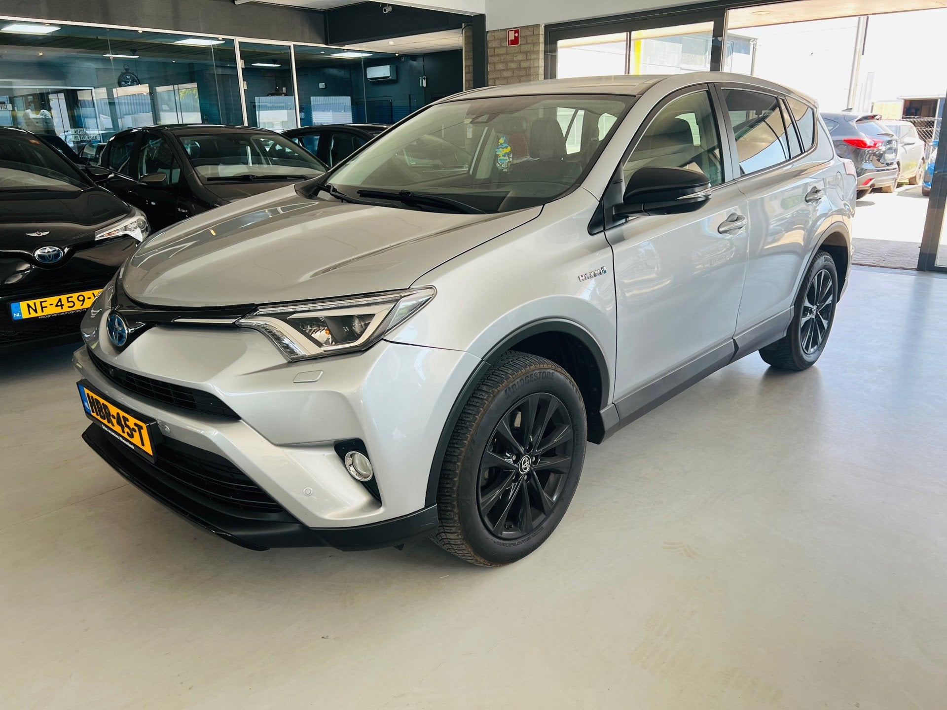 Toyota RAV4 2.5 Hybrid AWD Dynamic, Auto's, Automaat, 1650 kg, Leder, Bedrijf
