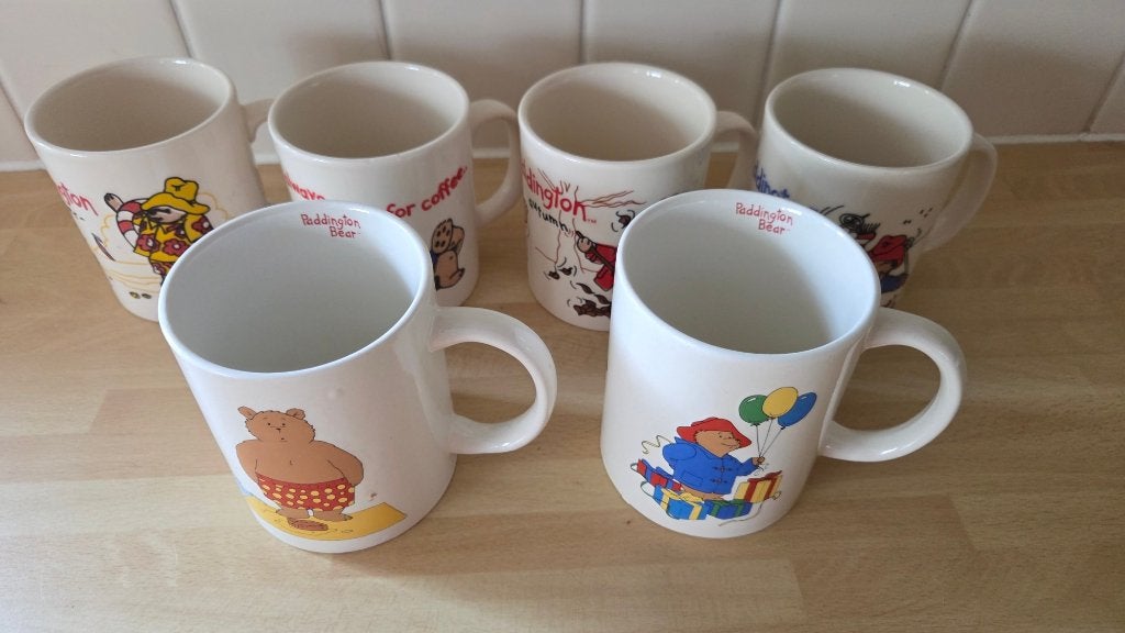 Douwe Egberts 6 mokken Beertje Paddington per stuk €2,50, Overige merken, Ophalen of Verzenden, Zo goed als nieuw, Overige stijlen