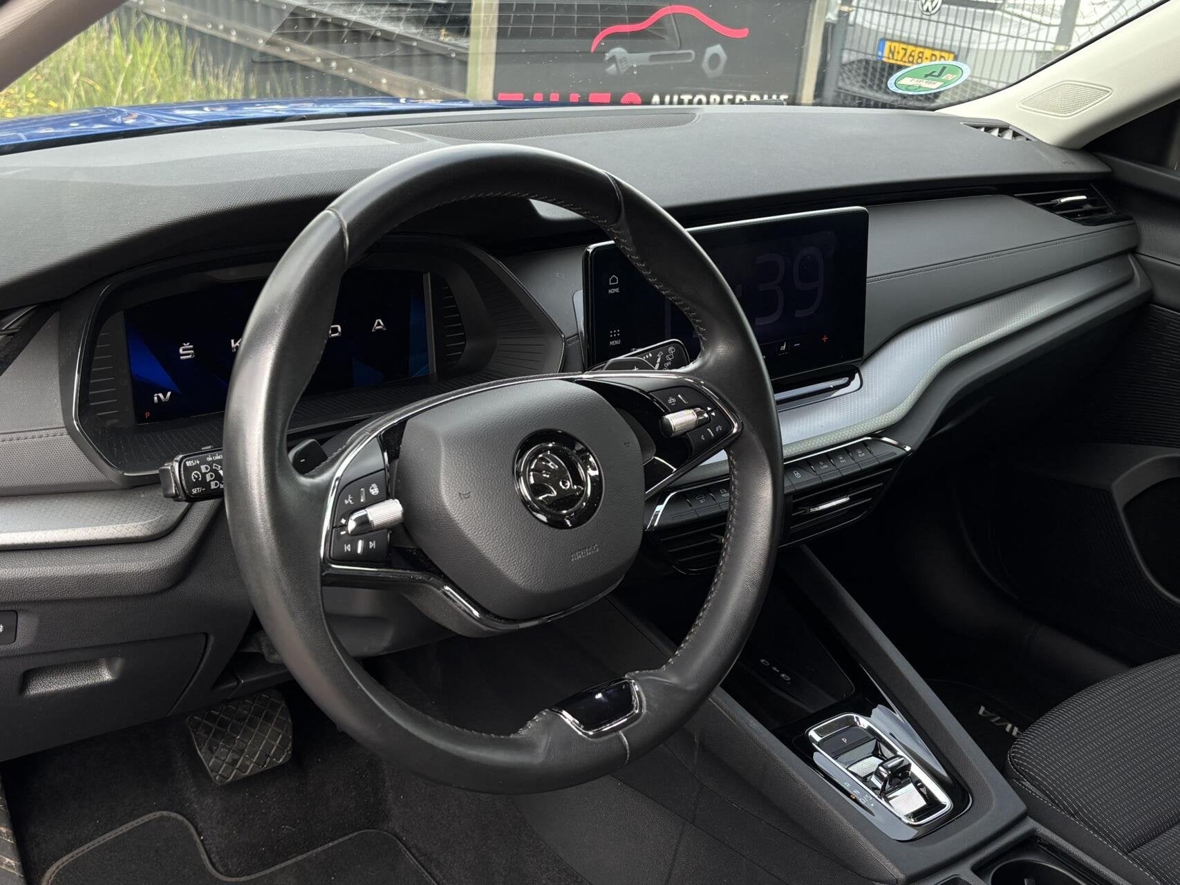 Skoda Octavia Combi 1.4 TSI iV PHEV Business Edition trekhaa, Auto's, Gebruikt, Euro 6, Blauw, Automatische klimaatregeling