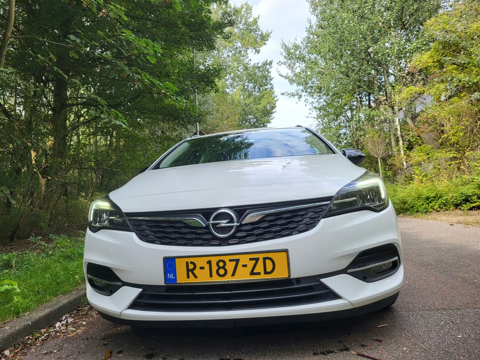 Opel Astra Tourer 1.2 Turbo 110pk 2021 Wit, Auto's, Voorwielaandrijving, Zwart, 1199 cc, Wit