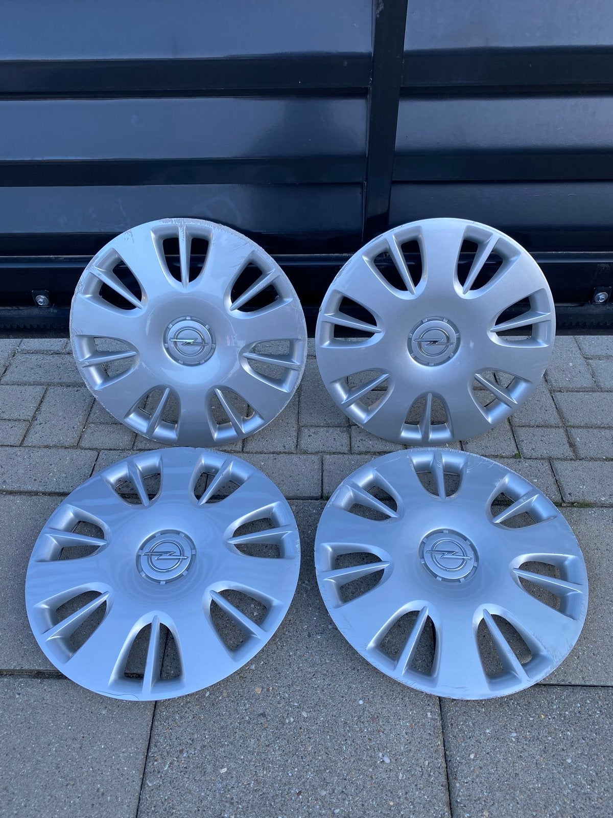 Set originele Opel Corsa D wieldoppen 15” inch, Ophalen of Verzenden, Gebruikt