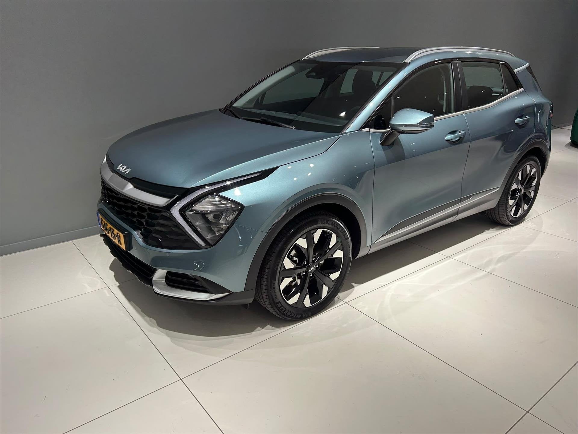 KIA Sportage 1.6 T-GDi 265pk Plug-In Hybrid AT6 4WD DynamicL, Auto's, Automaat, Stof, Gebruikt, 4 cilinders