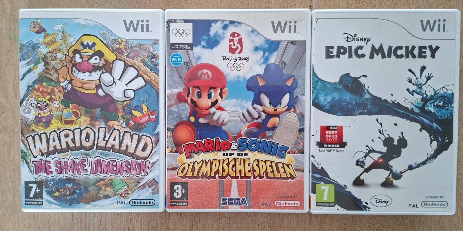 Wii Games: Wario Land, Mario & Sonic, Epic Mickey, Spelcomputers en Games, Ophalen of Verzenden, Zo goed als nieuw, Sport, 3 spelers of meer