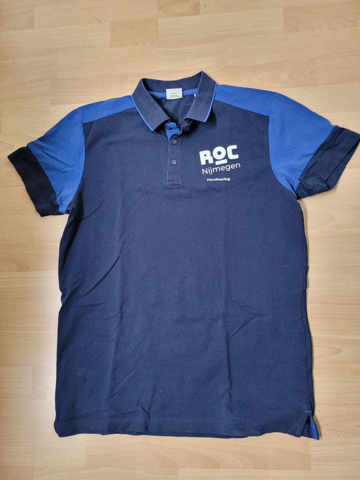 Polo heren ROC Nijmegen HTV (handhaving), Ophalen of Verzenden, Zo goed als nieuw, Maat 52/54 (L), Blauw