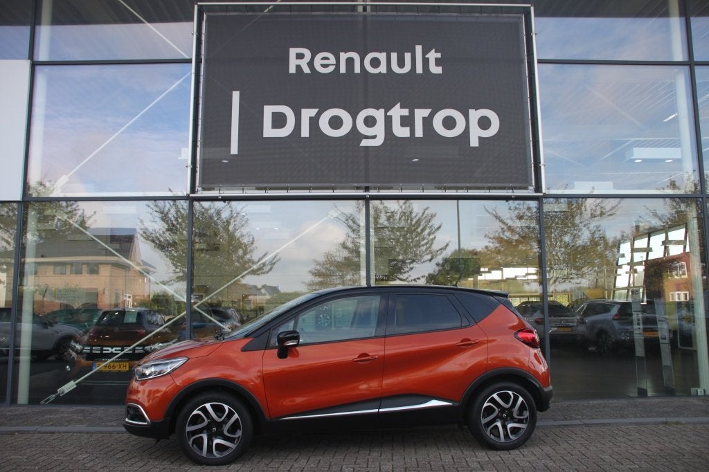 Renault Captur 120PK-DYNAMIQUE-AUTOM-95DKM-NAVI-CLIMA-CRUISE, Auto's, Stof, Zwart, Origineel Nederlands, LED verlichting
