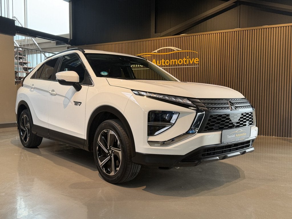 Mitsubishi Eclipse Cross 2.4 PHEV Instyle Adaptive Cruise co, Auto's, Mitsubishi, Automaat, 4 cilinders, Met garantie (alle), Wit