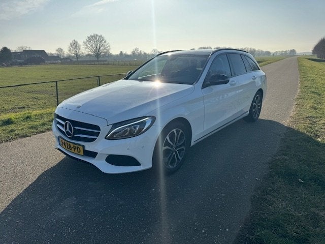 Mercedes-Benz C-Klasse Estate 200 Premium Plus (bj 2017), Auto's, Automaat, 4 cilinders, Leder en Stof, Wit