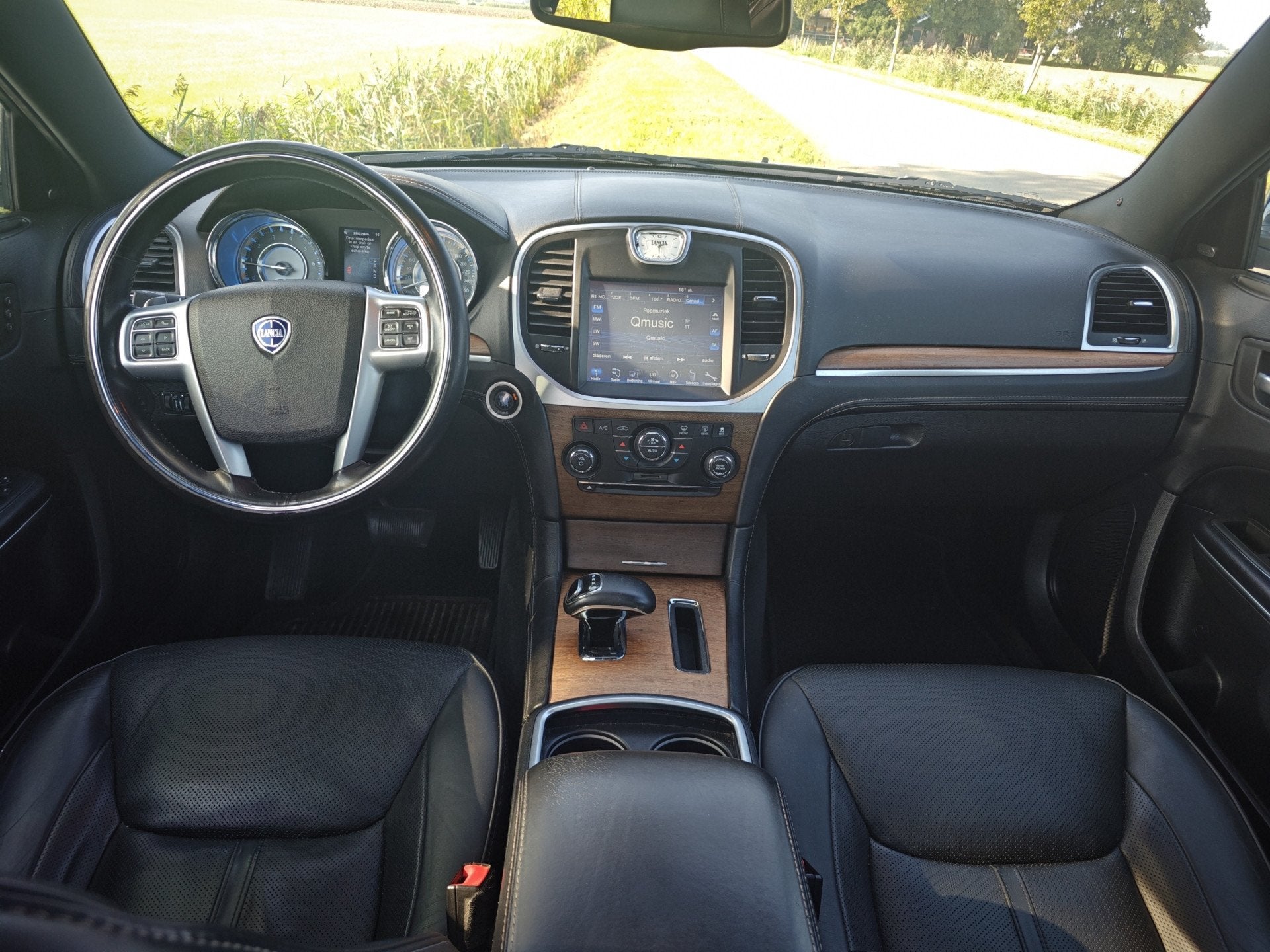 Lancia Thema 3.6 V6 Executive (bj 2012, automaat), Auto's, Automaat, Thema, Gebruikt, Zwart