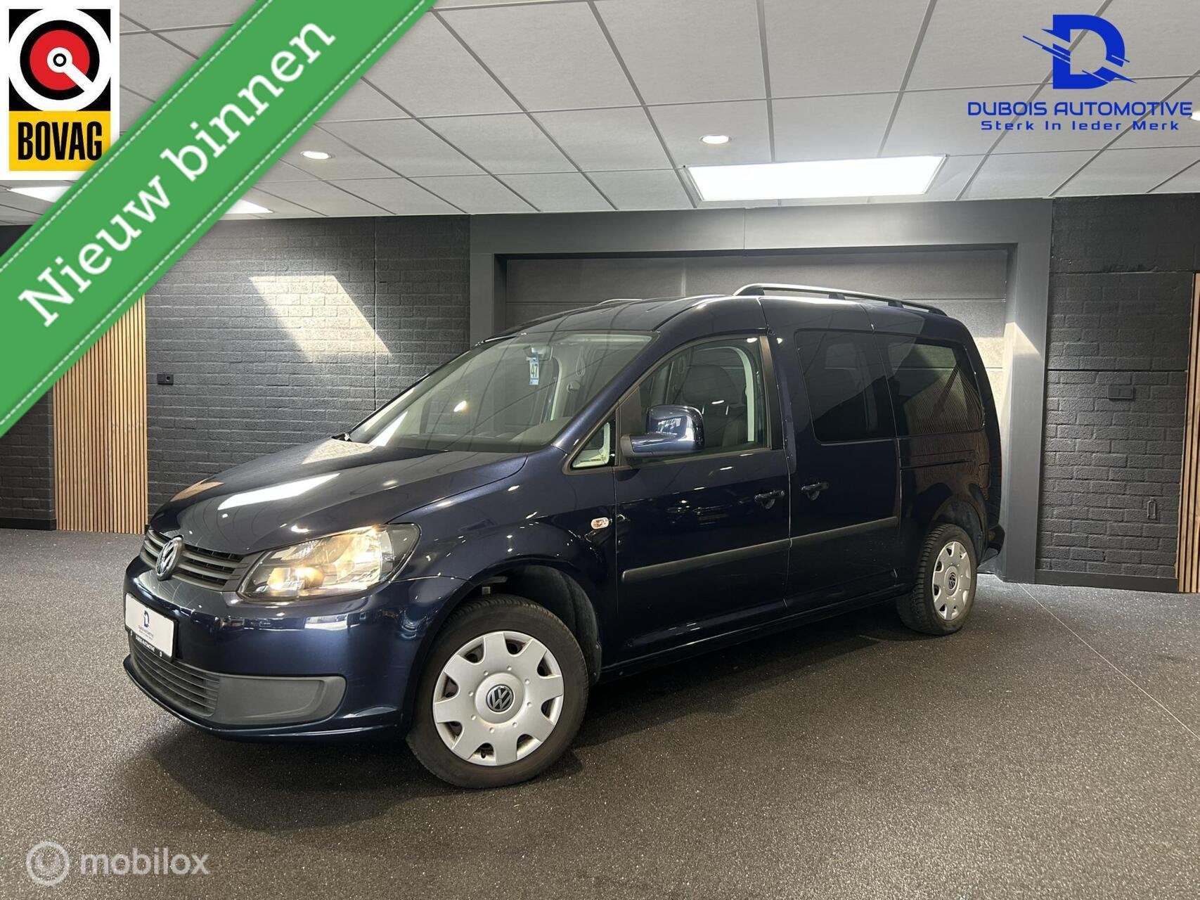 Volkswagen Caddy Maxi 1.2 TSI 7PERS|1EIG|Navi|Trekhaak|Cruis, Auto's, Gebruikt, Zwart, Met garantie (alle), Blauw