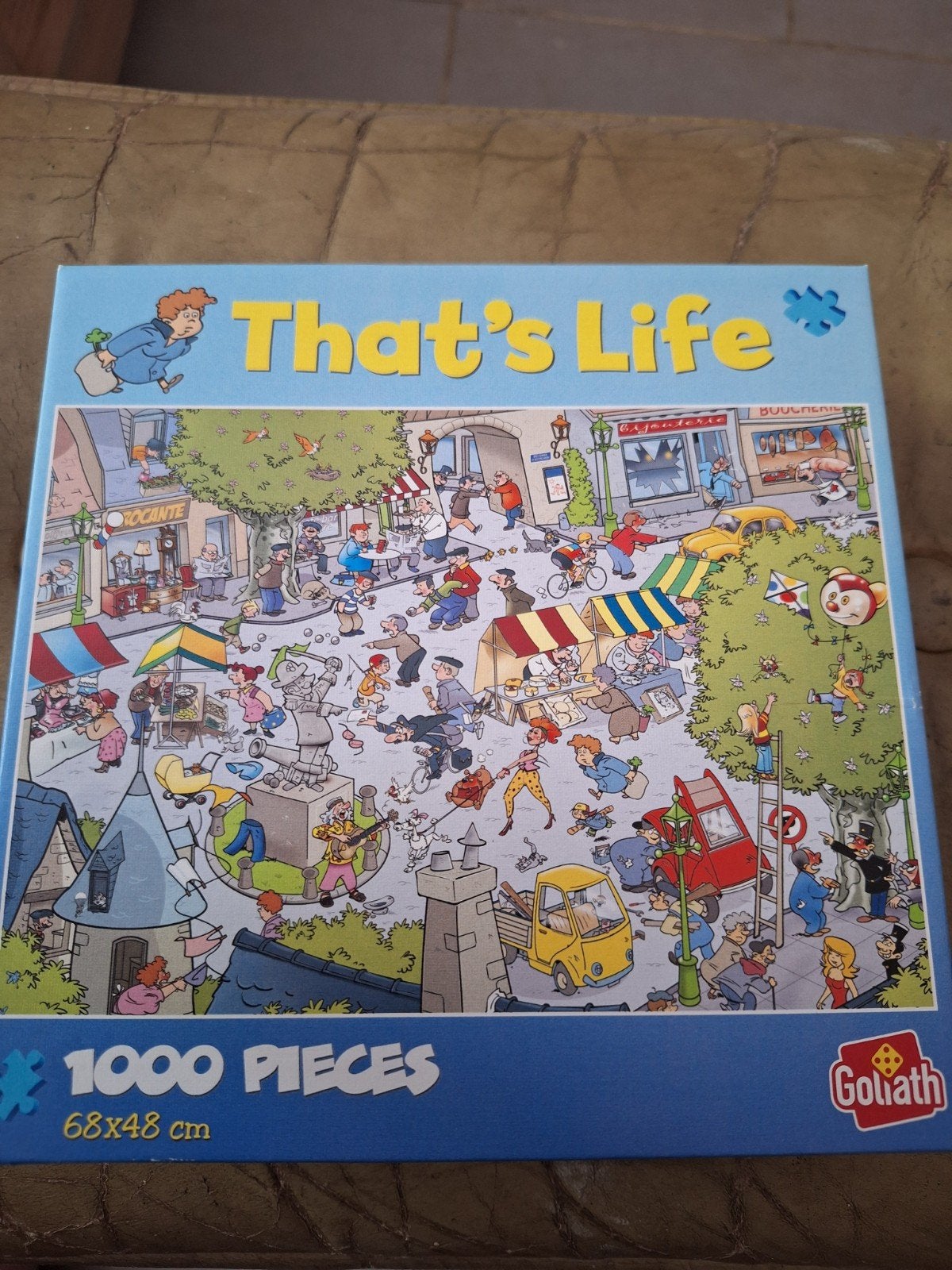 That's life puzzel dorpsplein 1000 stukjes, Ophalen of Verzenden, 500 t/m 1500 stukjes, Zo goed als nieuw, Legpuzzel