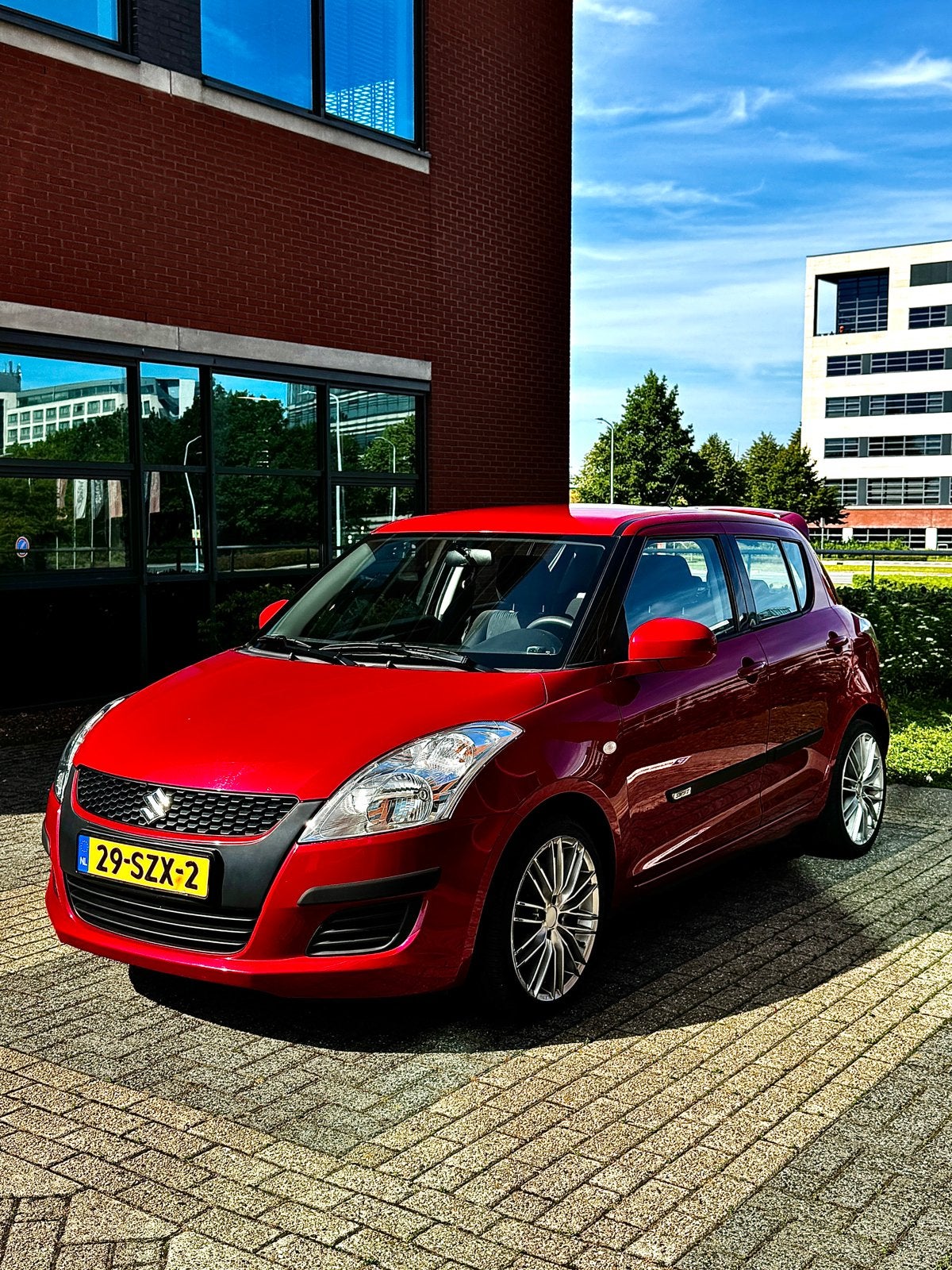 Suzuki Swift 1.2 5-D 2012 Rood 97000 NAP, Voorwielaandrijving, 4 cilinders, 400 kg, Swift