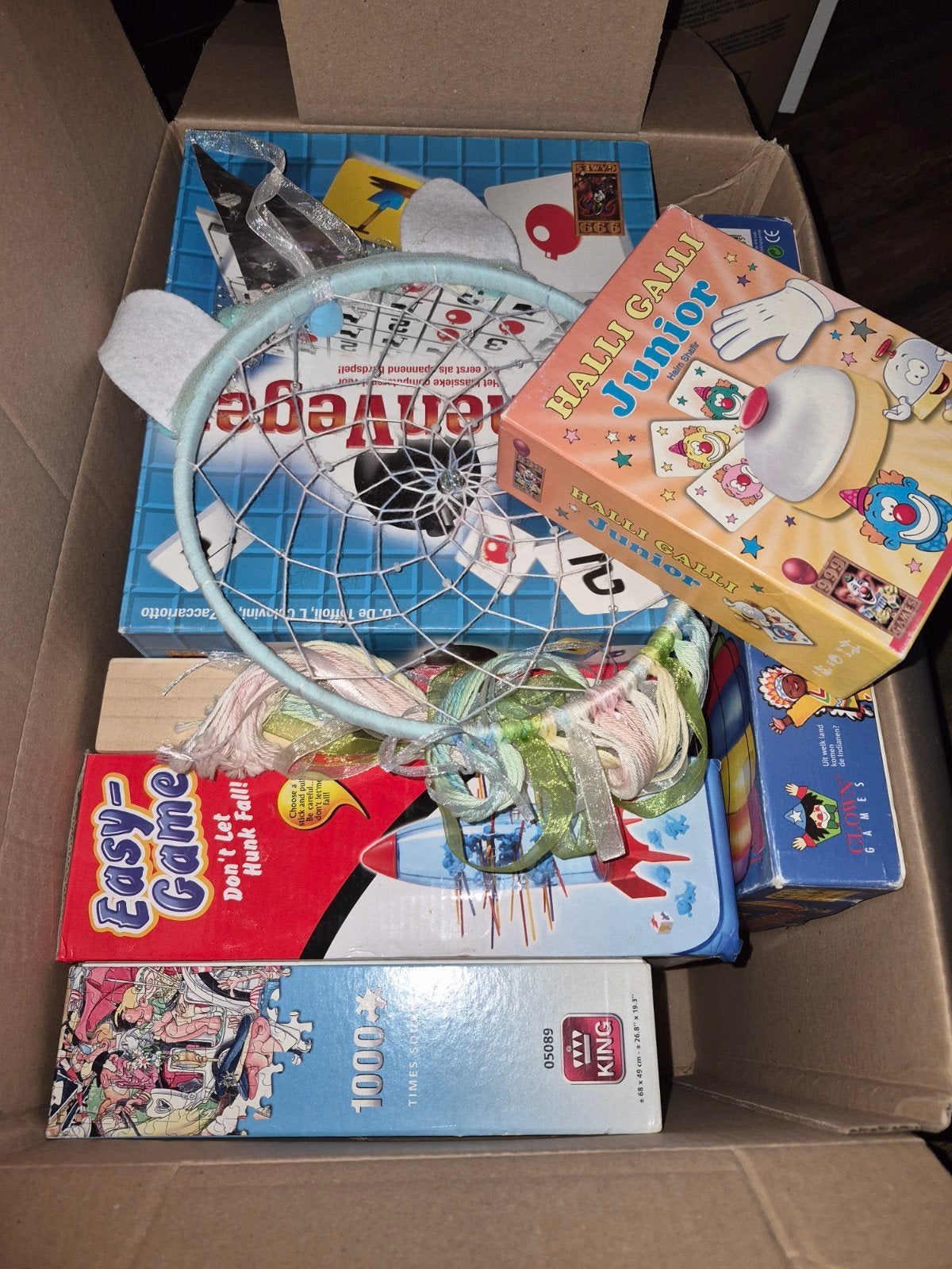 Verhuisdoos vol complete spellen en 1 puzzel, Ophalen