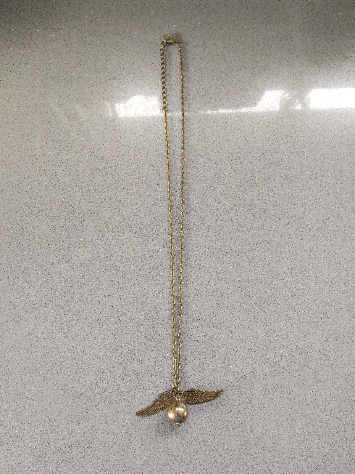 Zgan! Mooie Harry Potter "gouden snaai" ketting!, Verzamelen, Harry Potter, Ophalen of Verzenden, Zo goed als nieuw, Gebruiksvoorwerp